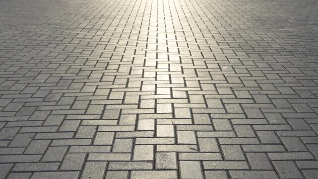 Herringbone Pattern Gray Paving Stones at Sunset
