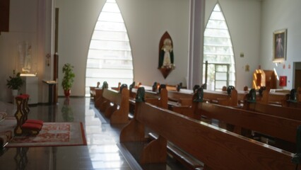 Church interior with wooden pews, altar and arched windows, blurred shallow bokeh focus background; background backplate copyspace calm.