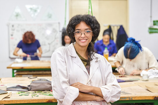 Happy woman artist smiling in art workshop