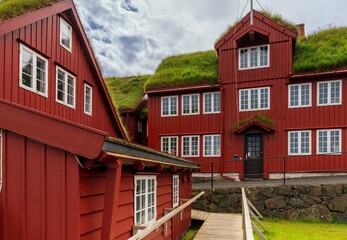 the colourful red wooden government buildings in the Tinganes District of the Faroe Islands capital of Torshavn