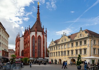 Fototapeta premium view of St. Mary's Chapel and the historic Falkenhaus on the Upper Market Square in downtown Wurzburg