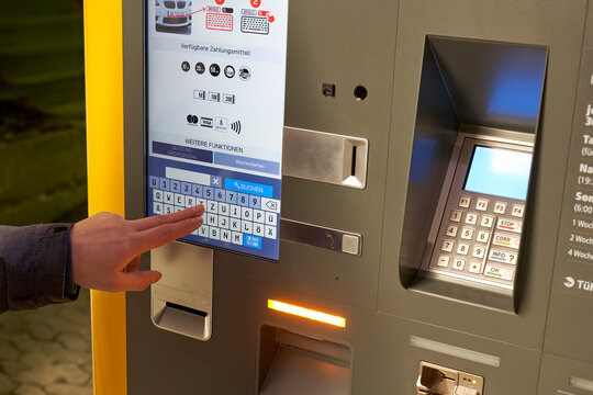 Tubingen, Germany - December 31, 2023: Check out at the ticketless parking system. Machine with digital display.
