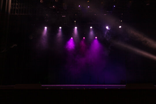 Theatrical scene without actors, scenic light and smoke