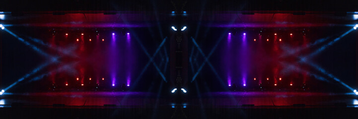 An empty stage of the theater, lit by spotlights and smoke before the performance