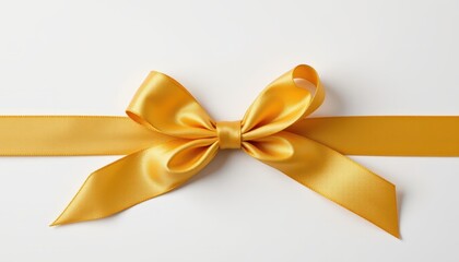 Fototapeta premium Shiny golden satin ribbon tied in a decorative bow centered on a bright white background