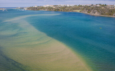 Visitors taking a kayak ride along the Mira River estuary