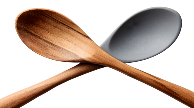 Two crossed wooden spoons against a dark background