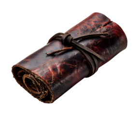 A rolled up ancient scroll tied with a leather strap on a black background