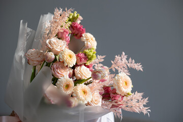 Elegant bouquet of roses, gerberas, and carnations with delicate accents