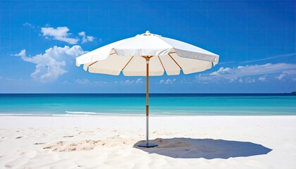 A White Beach Umbrella Stands On A Sandy Shore With A Turquoise Ocean And Blue Sky In The Background