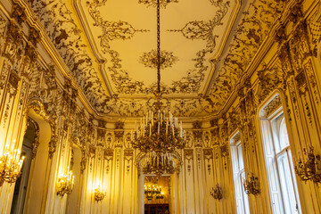 Elaborate chandeliers and gilded cream ceiling and walls in the 19th-century Neo-baroque Wenckheim...