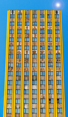 DREAM N°53 – Vertical lives, surreal building of windows and stories under a blue sky