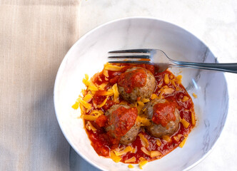 meat balls in cheese and sauce