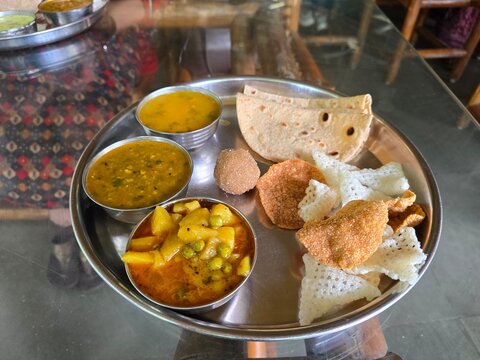 Ekta Nagar, Gujarat India - Oct 03 2025: Veg thali at Ekta tribal cafe at Ekta nursery , Ektanagar Statue of unity.