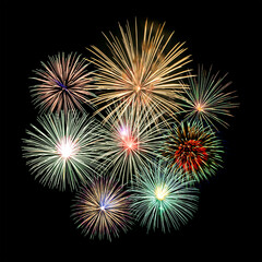 Fototapeta premium Fireworks of various colors and shapes burst in night sky