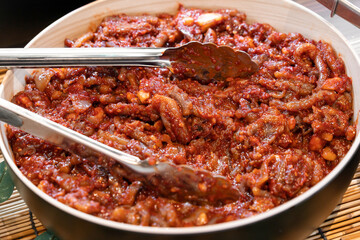 Salted baby octopus fermented with spicy seasoning. Bold, savoury and umami rich.