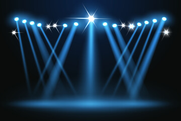 Bright blue concert spotlights create the effect of shining stars on the stage.