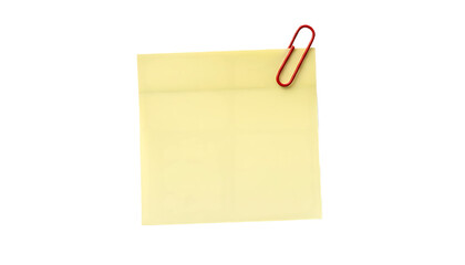 Yellow sticky note with a red paperclip attached for important reminders.