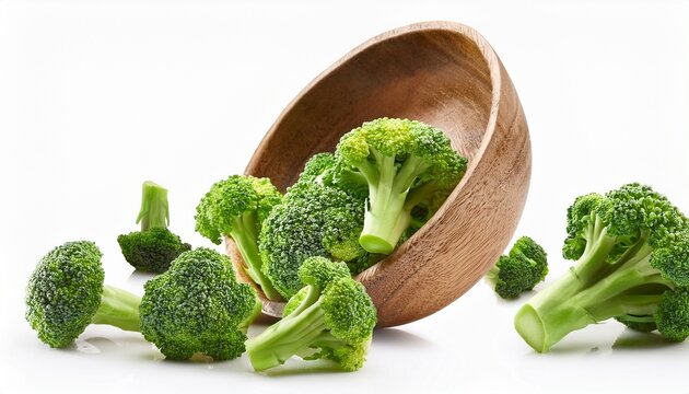 falling scattered broccoli florets isolated on white background