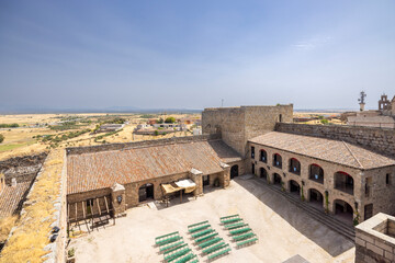 Obraz premium Oropesa Castle inner courtyard with event benches