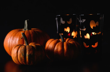 Pumpkins and tea light holders with funny eyes. 
