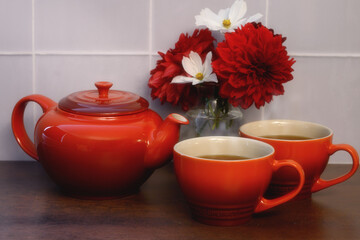 Tea pot and two tea cups