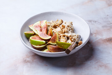 Oatmeal with figs, peanut butter, walnuts and maple syrup.