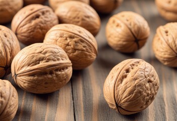 Close-up of walnuts scattered on a rustic wooden surface