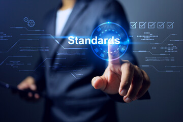 standard concept with businessman pointing on standards info graphic to implement the requirement...