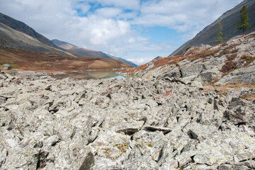 View on lake Lower Akchan and Akchan valley with a stone river in the foreground, the Altai Republic, Russian Federation