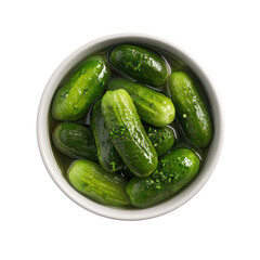Overhead view of a white bowl filled with numerous, crisp, green pickles in a brine solution
