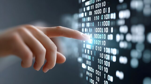 Close up of a human finger touching a futuristic screen filled with glowing binary code representing digital interaction and data flow