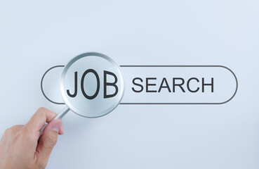 Job Search Concept. Magnifying glass focusing on word JOB in search bar, representing career exploration, recruitment, employment opportunities, hiring, online job hunting, finding new position,
