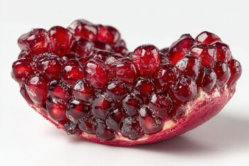 A close up view of fresh pomegranate seeds on white