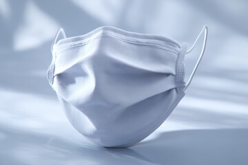 Close up view of pristine white medical face mask