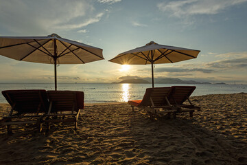 sunset on the beach, early morning on the central city beach of nha trang city
