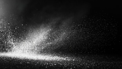 Glittering particles illuminated against a dark backdrop, creating a magical effect