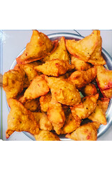 Samosas served on a platter golden brown