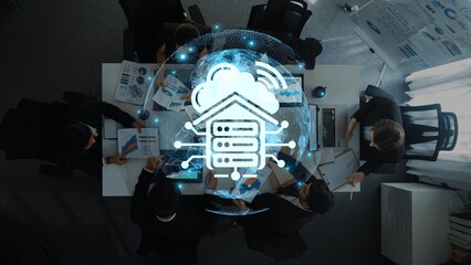 A professional business meeting centered on cloud technology innovations, showcasing data analysis and visualizations in an engaging modern office environment. Raster