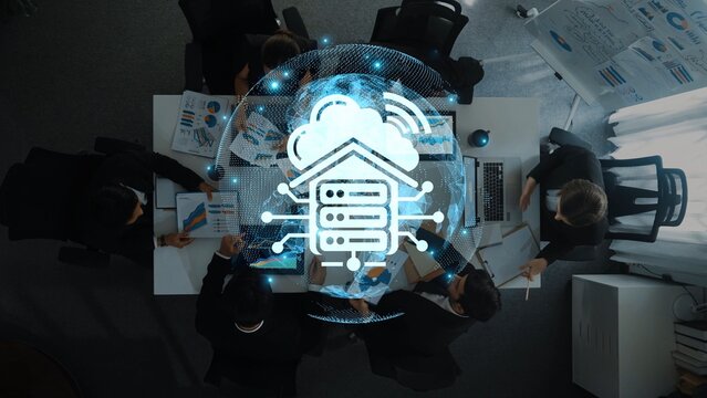 A professional business meeting centered on cloud technology innovations, showcasing data analysis and visualizations in an engaging modern office environment. Raster