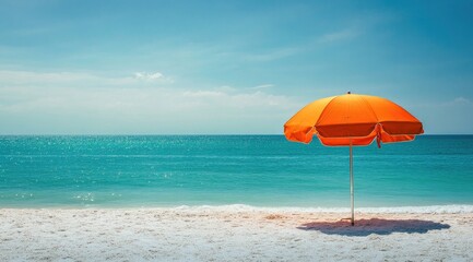 Orange beach umbrella on a sunny shore