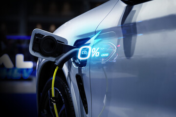 Power cable pump plug in charging power to electric vehicle EV car.