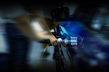 Power cable pump plug in charging power to electric vehicle EV car.