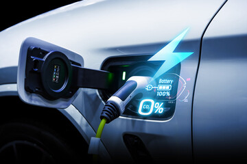 Power cable pump plug in charging power to electric vehicle EV car.