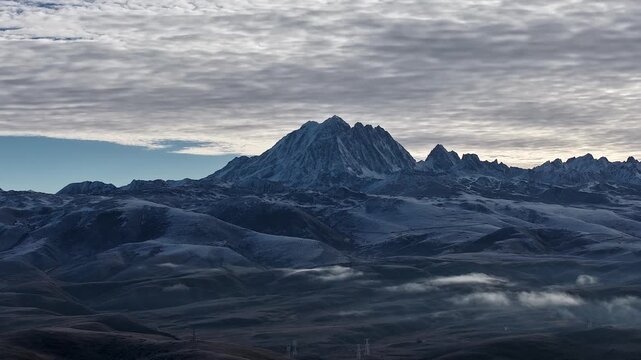 Panning Aerial Hyperlapse of Yala Snow Mountain in Morning Light Sichuan, China