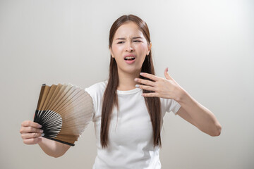 Suffering summer heat wave stroke, hot weather, tired asian young woman sweaty and thirsty,...