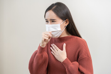 Unhealthy sickness, unwell asian young woman wearing mask coughing, have sore throat, suffering...