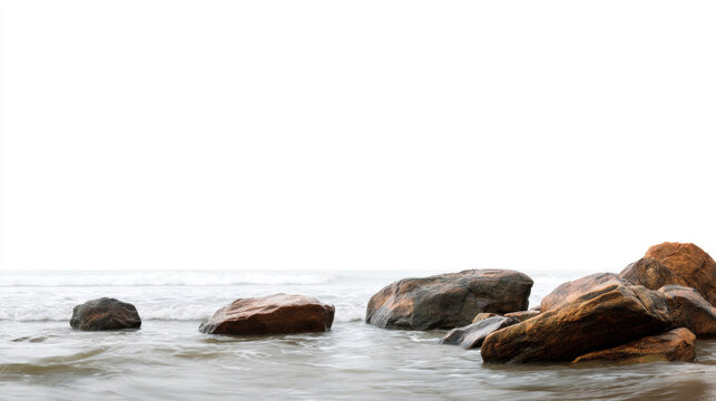 Rocks by the Sea, A minimalist panoramic landscape of a few large, smooth rocks on the beach, with calm waves washing over them. Ample copy space.