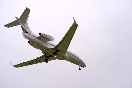 Private jet Netjets type Embraer Phenom 300E registration CS-PJD landing at Swiss Zurich Airport on a cloudy autumn day. Photo taken October 25th, 2025, Zurich Kloten, Switzerland.
