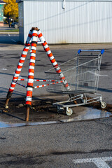 road construction site and a supermarket trolley